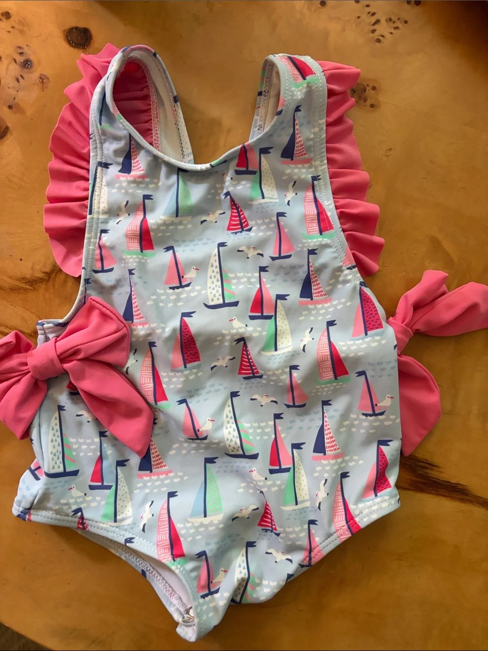 Stitchy Fish Sailboat One-Piece Swimsuit with Pink Ruffle & Bow